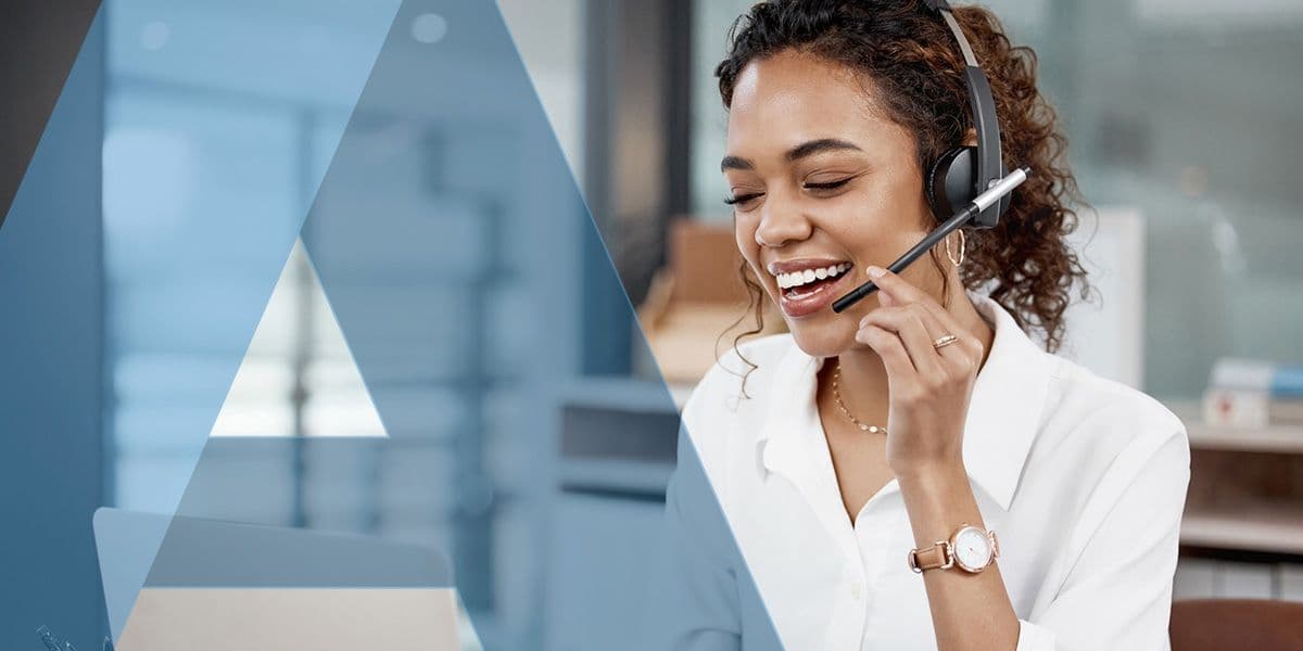 Customer service representative wearing a headset, providing professional support for commercial debt collection services.