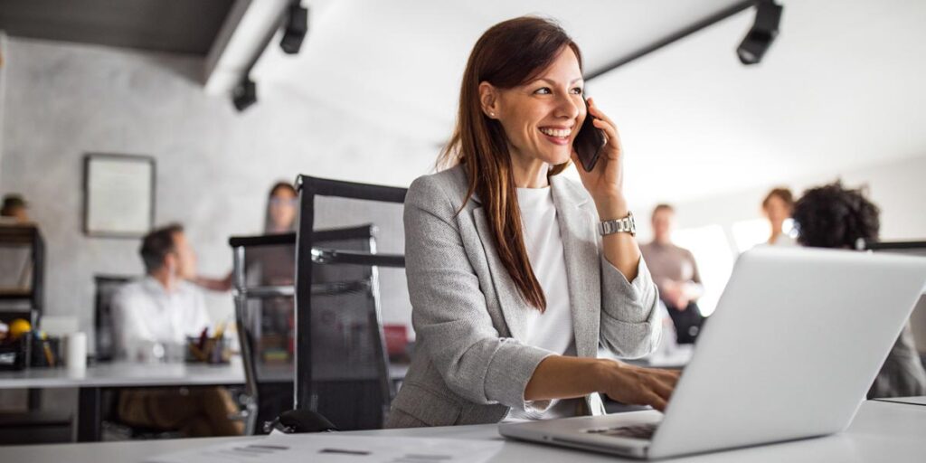 Woman on the phone providing 7 tips for successful b2b debt collector calls
